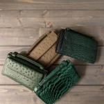 Picture of Dark Green Crocodile Skin Clutch Bag From Lulwa Al Khattaf